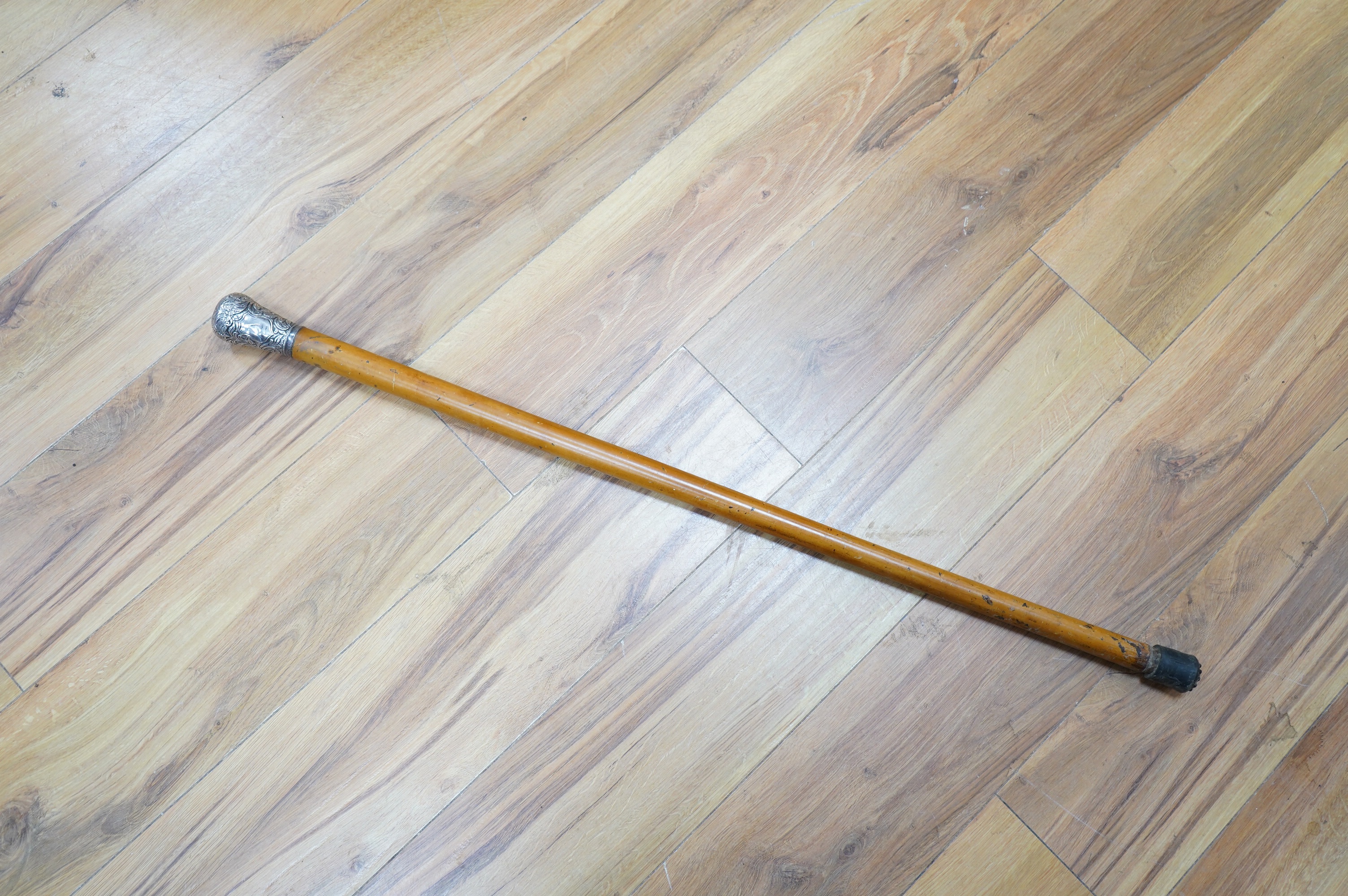 A Victorian silver mounted malacca walking stick, 92cm. Condition - fair to good.